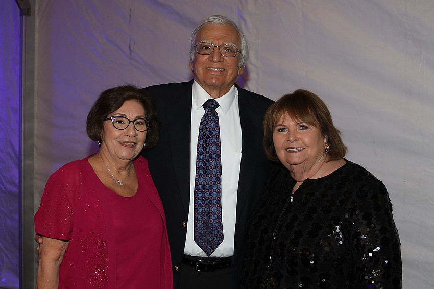 Slightly taller than Dick Vitale is brother John with wife Dee and friend Madelon Ward.