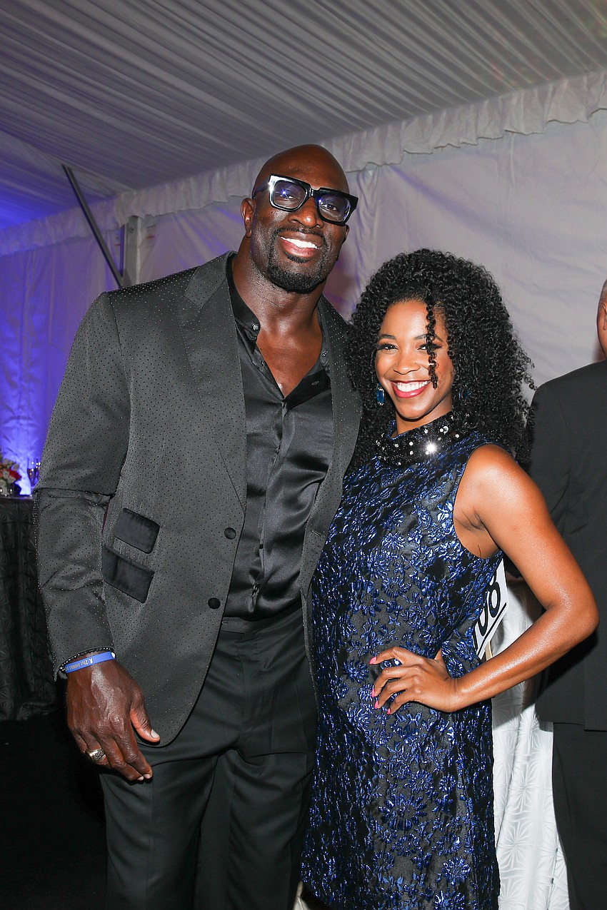 Thaddeus Bullard, aka WWE Legend Titus O'Neil and his date Java Ingram enjoy the VIP cocktail reception.