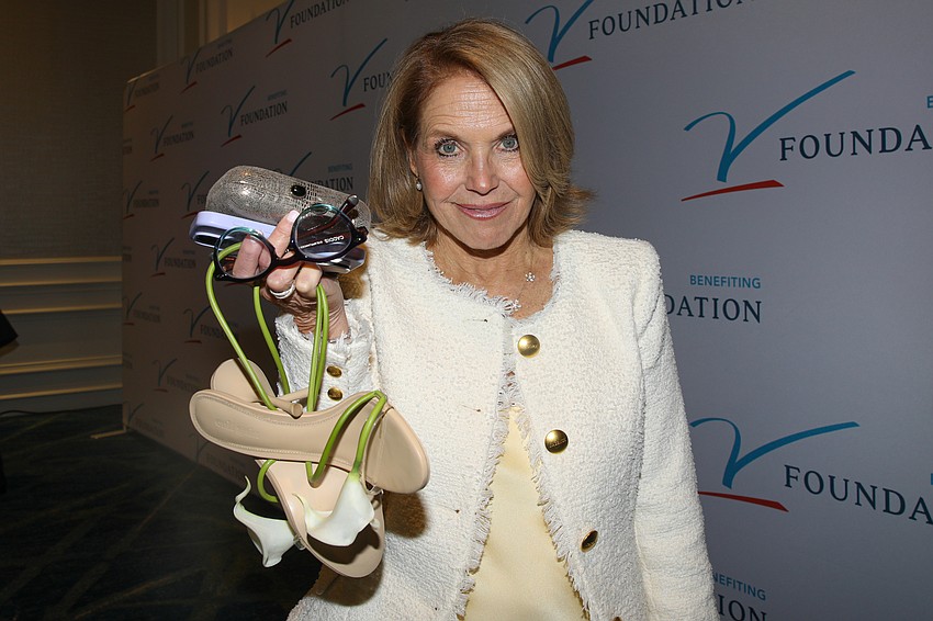 Katie Couric shows off her shoes that are 
