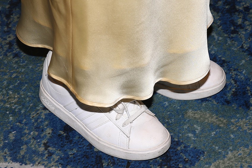 Katie Couric changed into a pair of size 7 Adidas lace-up kicks that are much more comfortable than her strappy green heels.