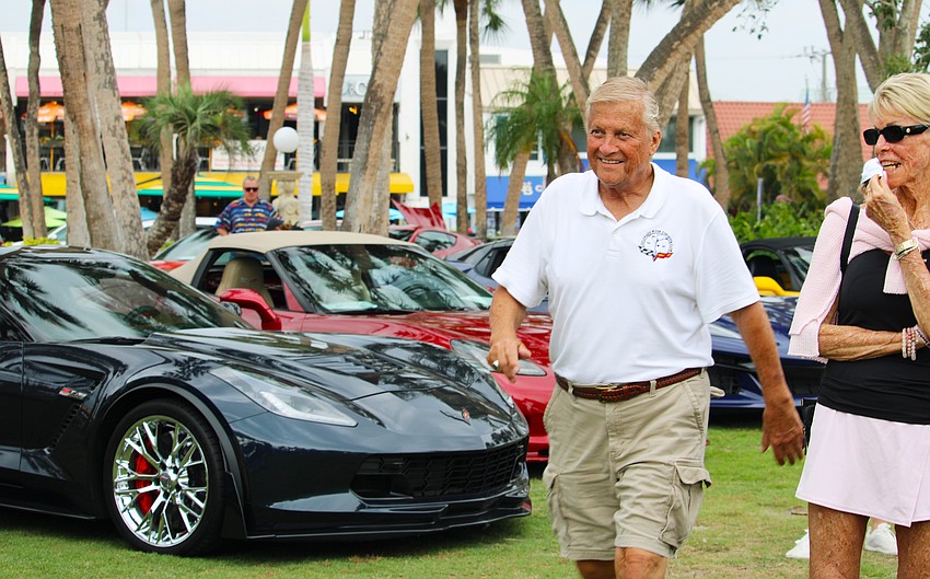 Jim Hanson walks up to accept the Skyway Favorite Award at Corvettes on the Circle in recognition of his drive all the way from Arizona to participate in the car show. He presented a 2002 Black Convertible.