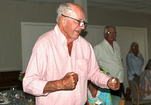 Don Schultz of Windward Bay celebrates as his top pick, Golden Tempo, crosses the finish line first at the Kentucky Derby. Schultz was the only person at the watch party to pick the long-shot horse.