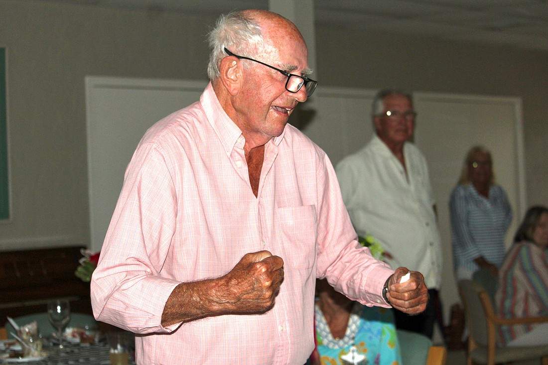 Don Schultz of Windward Bay celebrates as his top pick, Golden Tempo, crosses the finish line first at the Kentucky Derby. Schultz was the only person at the watch party to pick the long-shot horse.