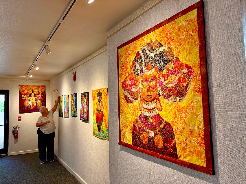 Quilting expert Peg Green finalizes the order of her series on ancient goddesses for a gallery showing at All Angels Episcopal Church. She envisioned this figure as perhaps celebrating her wedding day, adorned with hundreds of shells.