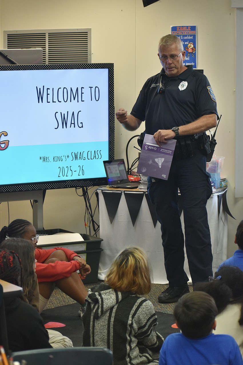 School Resource Officer Michael Clarkson speaks to a fifth grade class.