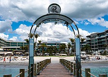 The St. Regis Longboat Key Resort installed a stainless steel arch on a private groin, leading to a lengthy dispute with the town of Longboat Key, with leaders claiming it violate’s the town’s sign code.