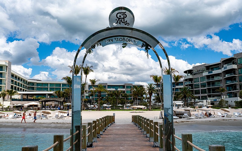 The St. Regis Longboat Key Resort installed a stainless steel arch on a private groin, leading to a lengthy dispute with the town of Longboat Key, with leaders claiming it violates the town’s sign code.