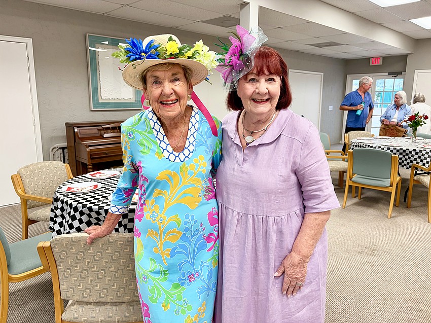 Dianne Schultz and Marjorie Davis wear their on-theme hats for the Kentucky Derby watch party.