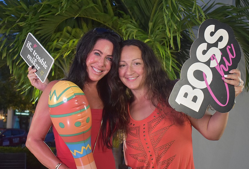 Lakewood Ranch's Denise Schilling and Holly Pratt test out the 360 Reese photo booth at the Agave Bandido Cinco de Mayo celebration.