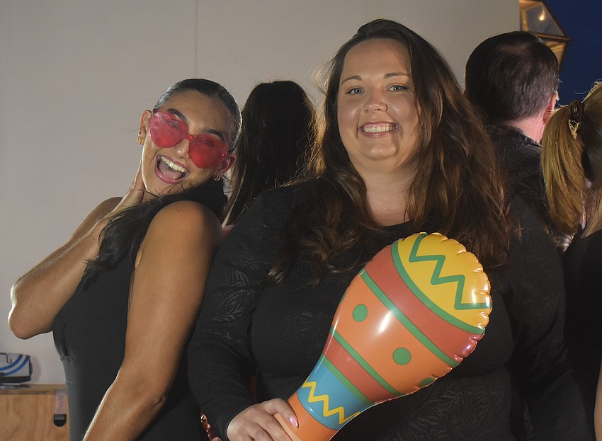 North Port's Paola-Marie Mannino and Lakewood Ranch's Jamie Huther take their turn at the 360 Reese photo booth during the Agave Bandido Cinco de Mayo celebration.