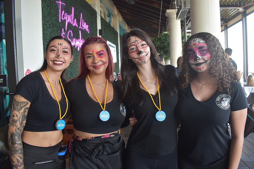 Agave Bandido employees Madisyn Casorla, Julianna Lugo, Maecy Casorla and Amaya Oyola show off their Cinco de Mayo-themed face paint.