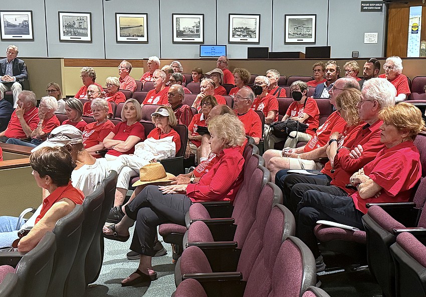 Residents of Bay Plaza and supporters wear red shirts in solidarity to their opposition to 1260 North Palm Residences.