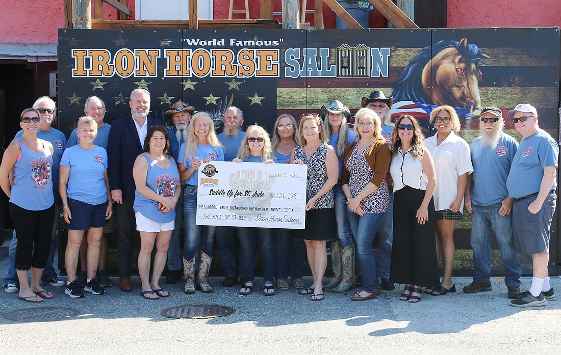 Saddle Up for St. Jude presented a check of $126,128 to St. Jude Children's Research Hospital on Tuesday, May 5, at the Iron Horse Saloon. Photo by Jarleene Almenas