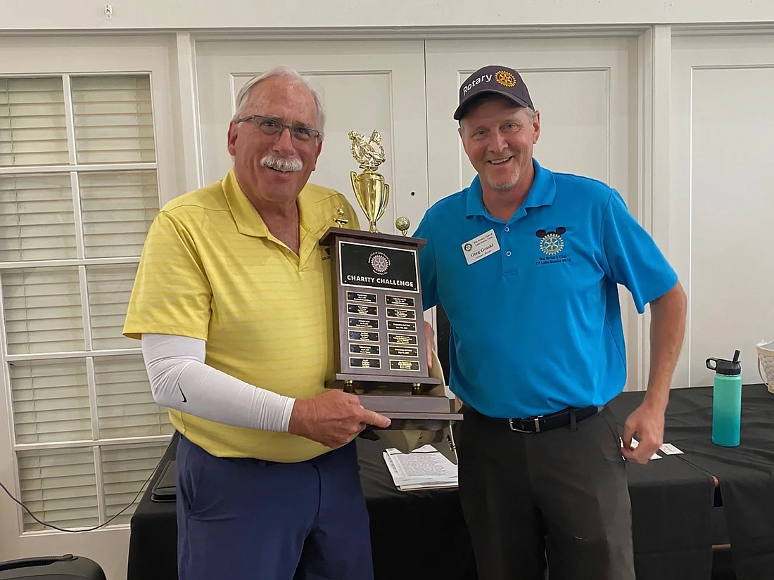 Jared Wolovnick received trophy at last year’s tournament from Gregory Gorski.