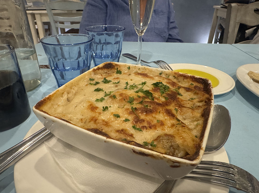 Pastitsio ($25) made with Greek macaroni with ground beef, fresh herbs topped with a creamy béchamel sauce.