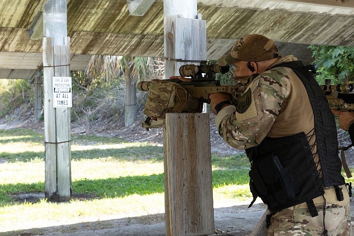 Sergeant Frank Gamarra aims down the sight of a rifle during the Sniper craft Challenge. Photo courtesy of the Flagler County Sheriff’s Office.