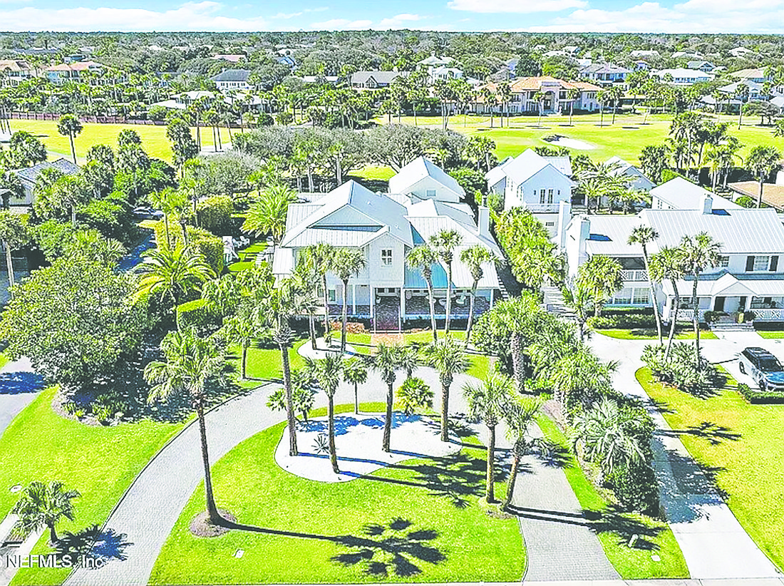 With golf frontage, this two-story home features five bedrooms, five bathrooms, an office, guest suite, balcony, porches, patio, swimming pool 
and three-car garage.
