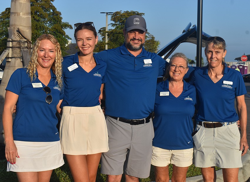 The Lakewood Ranch Community Foundation's Kate Mulligan, Kayla Harris, Keith Pandeloglou, Lisa Lawler and Victoria Campbell await the arrival of the 83 golfers at Calusa Country Club.
