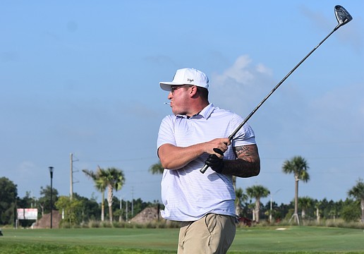Bradenton's Trey Johnson finishes his swing during the Lakewood Ranch Community Foundation Golf Tournament, which raises funds for local nonprofits.