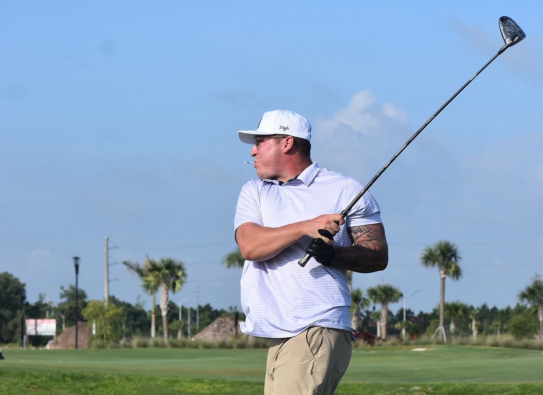 Bradenton's Trey Johnson finishes his swing during the Lakewood Ranch Community Foundation Golf Tournament, which raises funds for local nonprofits.