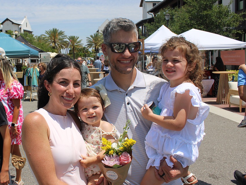 Joelle, Adelina (13 months), Tom, and Gianna Sicking of Lakewood Ranch enjoy the Petals and Poses event Saturday, but Joelle says it isn't much different than their normal routine, being together and loving Waterside Place.