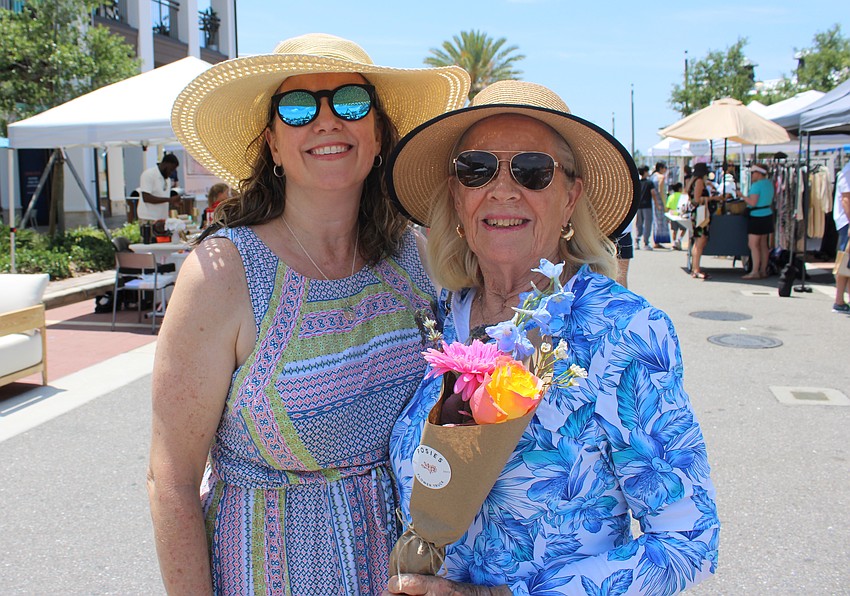 Kristen Parker made sure her mom, Linda Fanning, had some pretty flowers at the Petals and Poses event at Waterside Place Saturday. Both live down the street from each other in Heritage Harbour.