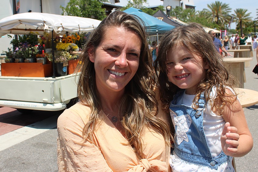 Sarasota's Taryn Thomore enjoys the event with her daughter, Kensley Kratz. 