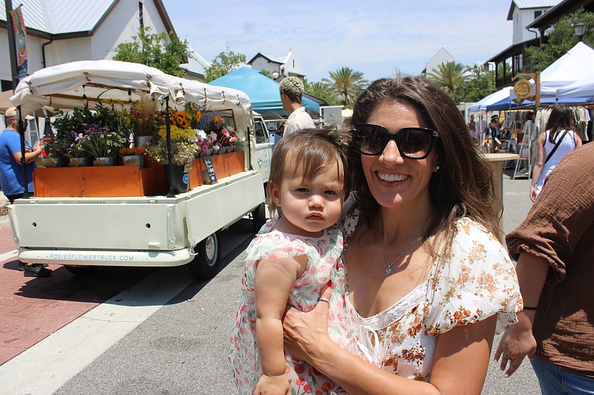 Emma and Kylee Kwan of Lakewood Ranch feel the support given during the Mother's Day event Saturday. Is being a mother hard? 