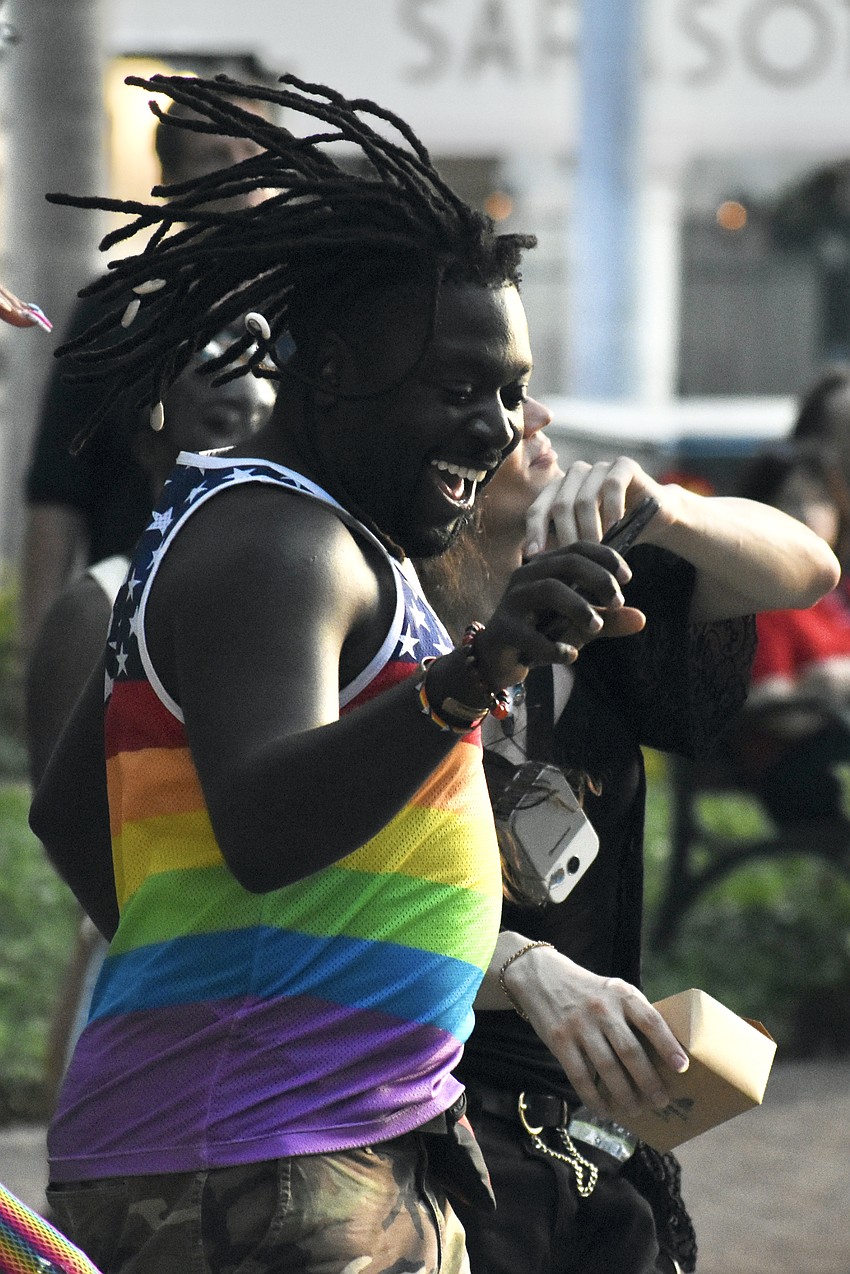 Event emcee Travis Ray embraces the energy of the music.