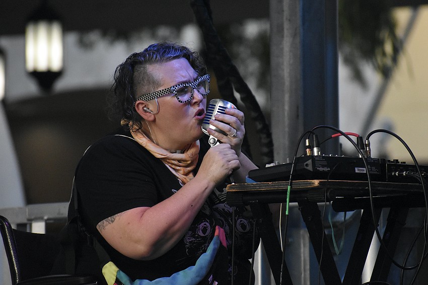 Shannon Fortner, founder and executive director of Fabulous Arts Foundation, and a band member of MeteorEYES, performs on stage.