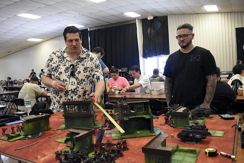 John Wreford and Jake Guimond play a game of Warhammer.