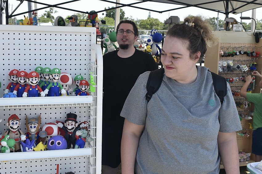 Ariana Miraglia and her friend Seth Lew browse the merchandise.