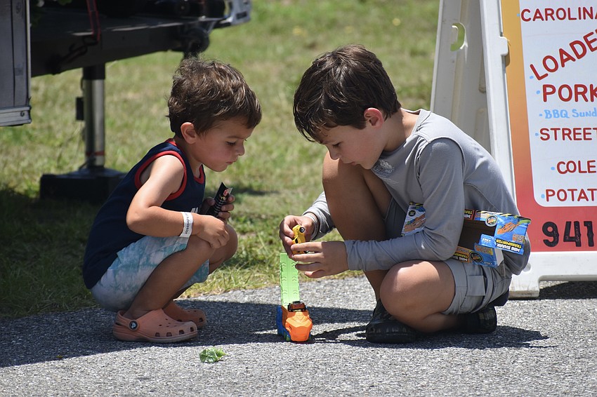 Ian Sweeney, 7, and Ash Sweeney, 3, play with some new toys.