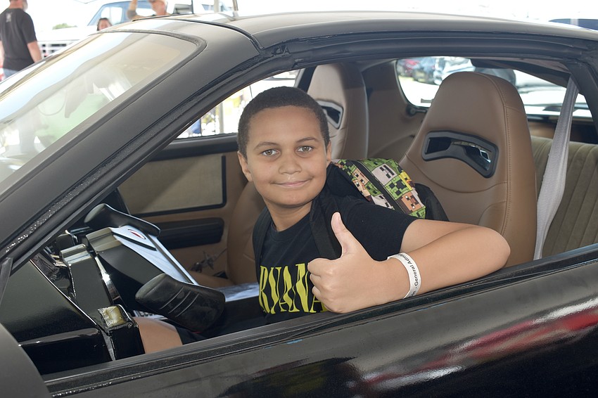 Dallas Williams, 10, sits in a hobbyist replica of Knight 2000, the vehicle from the TV series 
