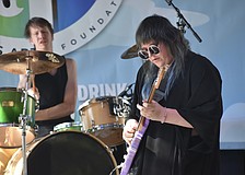 William Gensmer and Zaeta, of The Tilt, perform on stage.