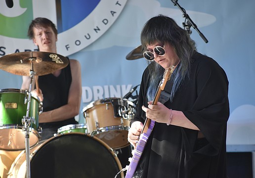 William Gensmer and Zaeta, of The Tilt, perform on stage.