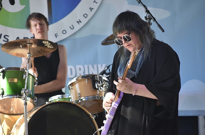 William Gensmer and Zaeta, of The Tilt, perform on stage.