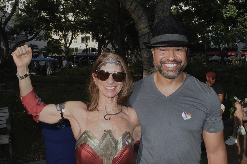 Emily Olsen brings some superhero style, standing alongside Percy Ray Ballard.