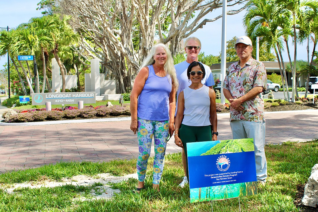 Team members at Longboat Harbour Condominiums and the Sarasota Bay Estuary Program are working together to show how residents and researchers can all contribute to building a stronger ecosystem. Coordinators recently put up new signs recognizing the work volunteers are doing to remove invasive plants and add Florida-friendly flora. Pictured are Mary and Rob Dice, Kakali Banerjee and Ken Stewart.