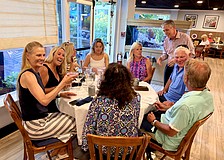 Michael Garey, owner of the Lazy Lobster restaurant, greets a table full of attendees on their second stop for the first Longboat Key Turtle Crawl fundraiser on May 7. The foodie fundraiser benefits sea turtle research being done this nesting season by Longboat Key Turtle Watch and Mote Marine.