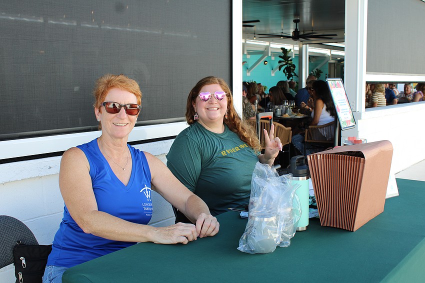 Karey Kaine and Lexi Fox check in the last few guests at the first leg of the inaugural Turtle Crawl on Longboat Key.