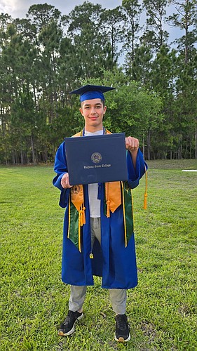 Ormond Beach resident, Imronbek Kadirbek received his Bachelor’s of Applied Science in Healthcare Administration at only 15-years-old from Daytona State College on Tuesday, May 12. Photo by Nargiza Ayupova