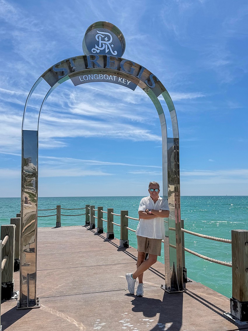 Chuck Whittall, developer and owner of St. Regis Longboat Key Resort, posed for a picture under the stainless steel arch that has sparked controversy in the town of Longboat Key. Chuck Whittall, developer and owner of St. Regis Longboat Key Resort, posed for a picture under the stainless steel arch that has sparked controversy in the town of Longboat Key.