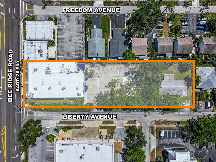 An adjacent duplex parcel was included in the sale.