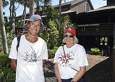 Dan Moriarty, community liaison and board member of the Tree Foundation, and Community Relations Co-Chair Janie Pratt stand on the campus.