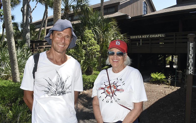 Dan Moriarty, community liaison and board member of the Tree Foundation, and Community Relations Co-Chair Janie Pratt stand on the campus.