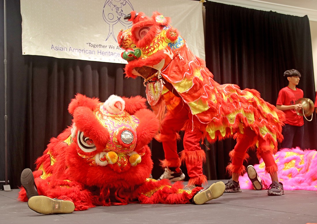 The Orlando Young Lions of Youth Enrichment and Senior Services performed a lion dance to open the festival.