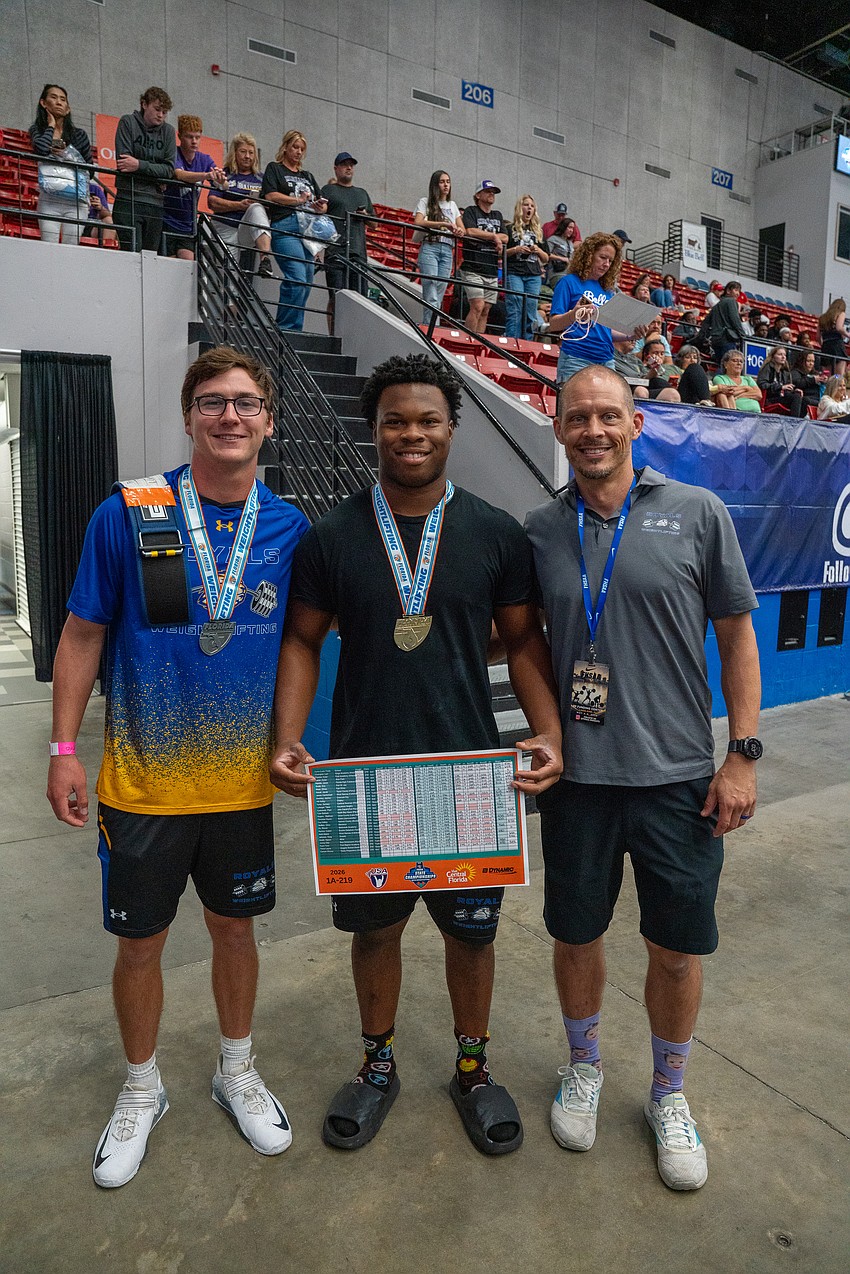 After making history for The First Academy, Kyler Priester, middle, celebrated his state title with his teammate Jackson Jones and head coach Trey Tyler. After making history for The First Academy, Kyler Priester, middle, celebrated his state title with his teammate Jackson Jones and head coach Trey Tyler.
