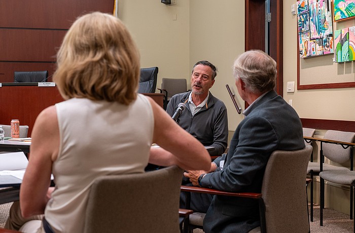 City of Anna Maria Mayor Mark Short shares an update on the Anna Maria Pier to Longboat Key Mayor Debra Williams (left) and Longboat Key Town Manager Howard Tipton (right) at a Barrier Island Elected Officials meeting May 6.