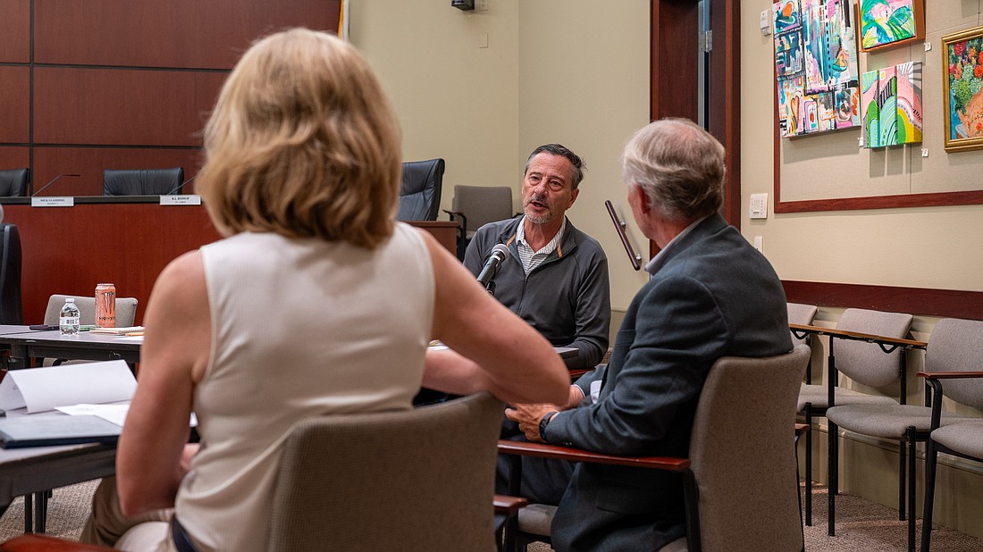 City of Anna Maria Mayor Mark Short shares an update on the Anna Maria Pier to Longboat Key Mayor Debra Williams (left) and Longboat Key Town Manager Howard Tipton (right) at a Barrier Island Elected Officials meeting May 6.